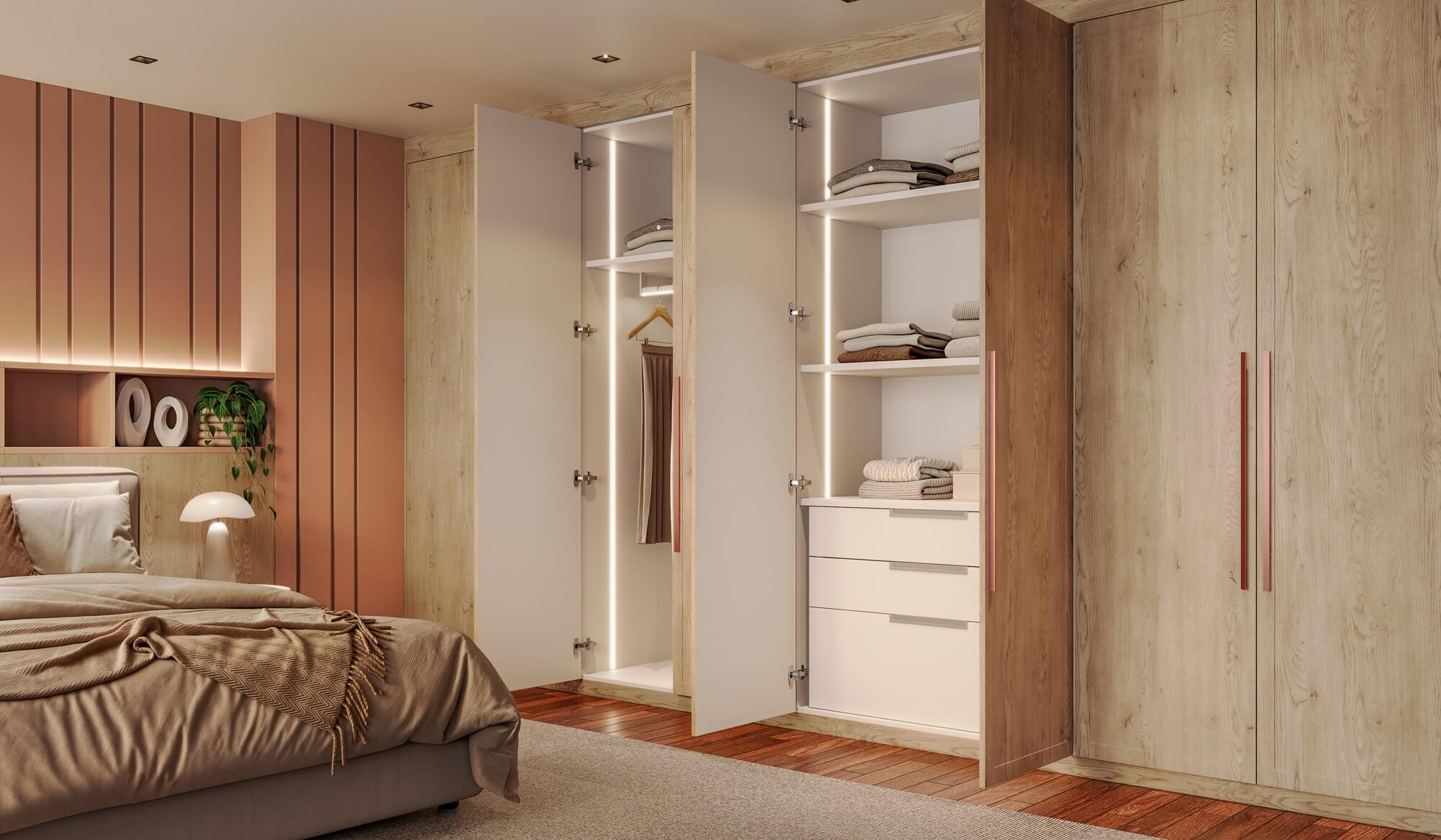 A nova Coleção Zeit da Finger Ambientes Personalizados, oferece uma linha de móveis planejados de alto padrão para ambientes que valorizam o design, o conforto, bem-estar e a funcionalidade. A nova coleção é um convite para experimentar e sentir o tempo e a vida. Esse ambiente mostra um dormitório de casal, com roupeiro em tons de madeira clara mais rústica, estilo que destaca a brasilidade, design afetivo, a arquitetura vernacular e valorização das texturas. Detalhe para a iluminação embutida nos roupeiros na parte interna, e nas portas COTTAGE que trazem o ar do campo para o projeto de forma sofisticada. O ambiente tem a forte presença da biofilia, através da natureza que permeia o ambiente através das grandes janelas. A imagem mostra o roupeiro aberto com composição interna de prateleiras, gavetão e duas gavetas, além de ter o roupeiro iluminado.